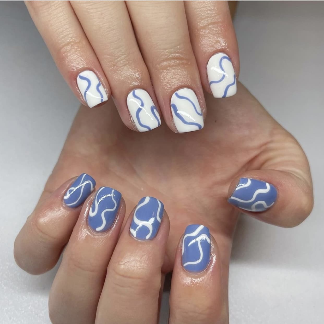 blue and white swirl nails